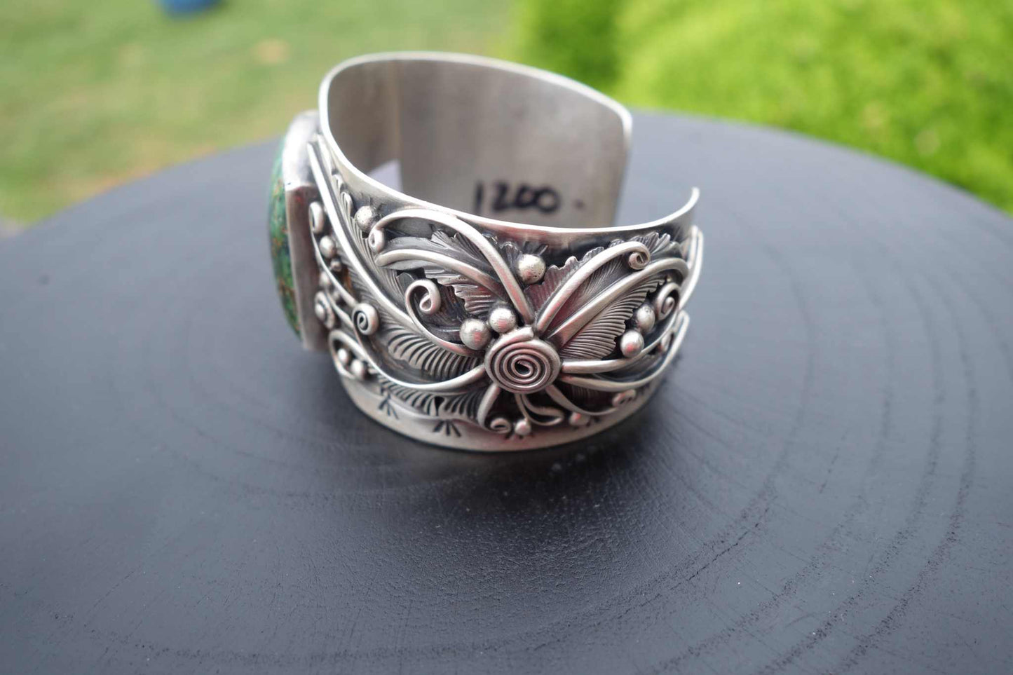 Sterling silver cuff bracelet with square green Blue Moon turquoise stone.