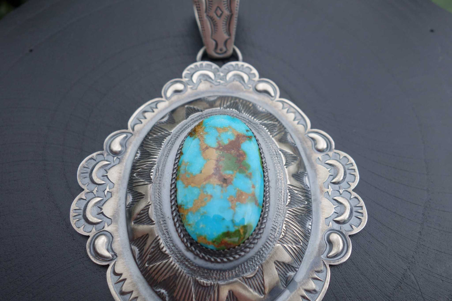 Royston Turquoise Pendant with intricate silver detailing, Native American made.