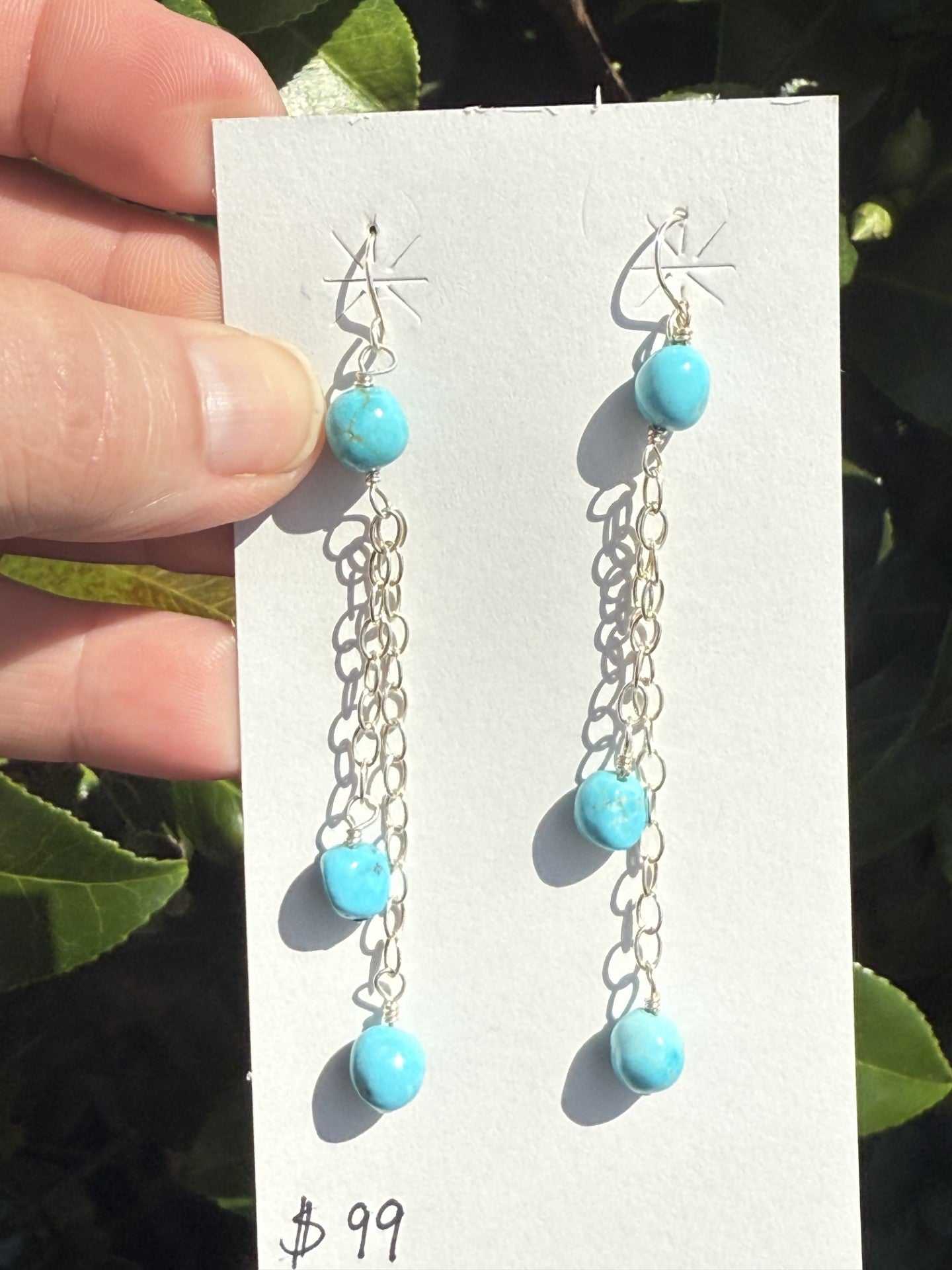 Sterling silver chain dangle earrings with Kingman turquoise balls by Navajo artist, 3 inches long.