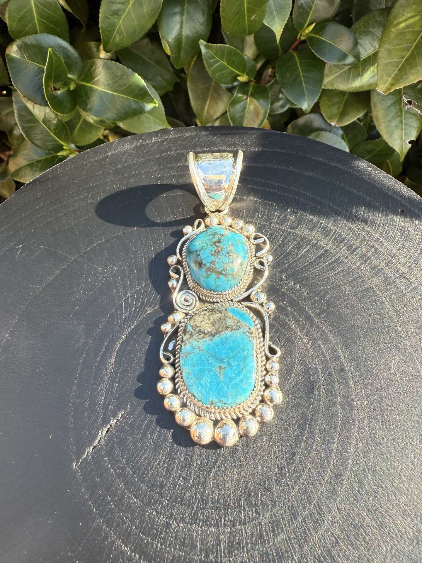 Kingman Turquoise Pendant with two turquoise stones and sterling silver detailing by Ray Nez