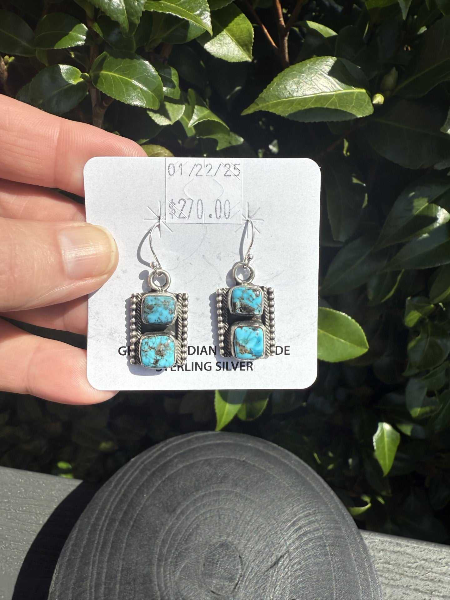 Handcrafted Navajo Kingman Turquoise Dangle Earrings with vibrant blue stones and dark matrix in sterling silver