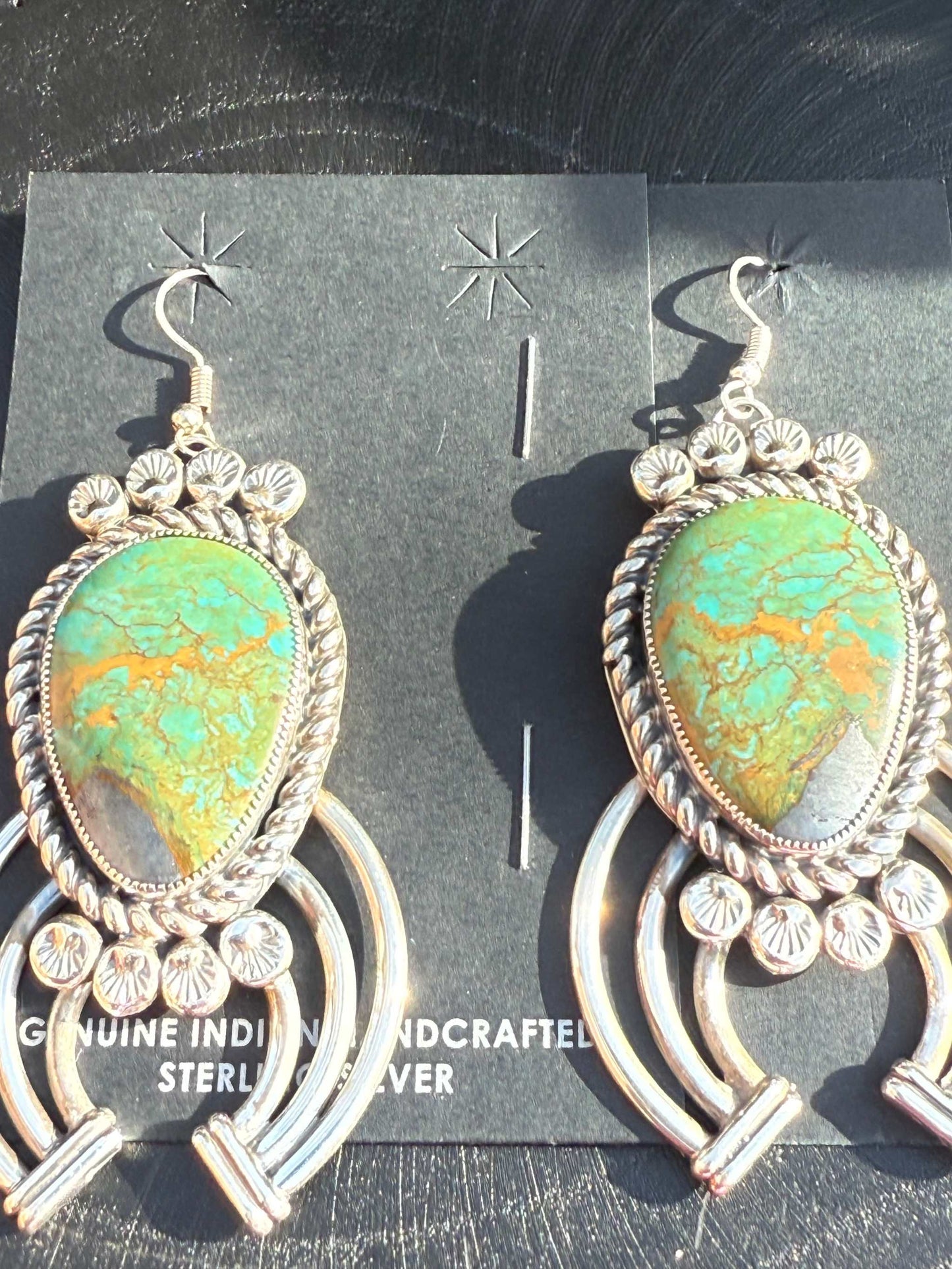Royston Turquoise earrings by Navajo artist Limbert Perry with intricate silver design and statement turquoise stones