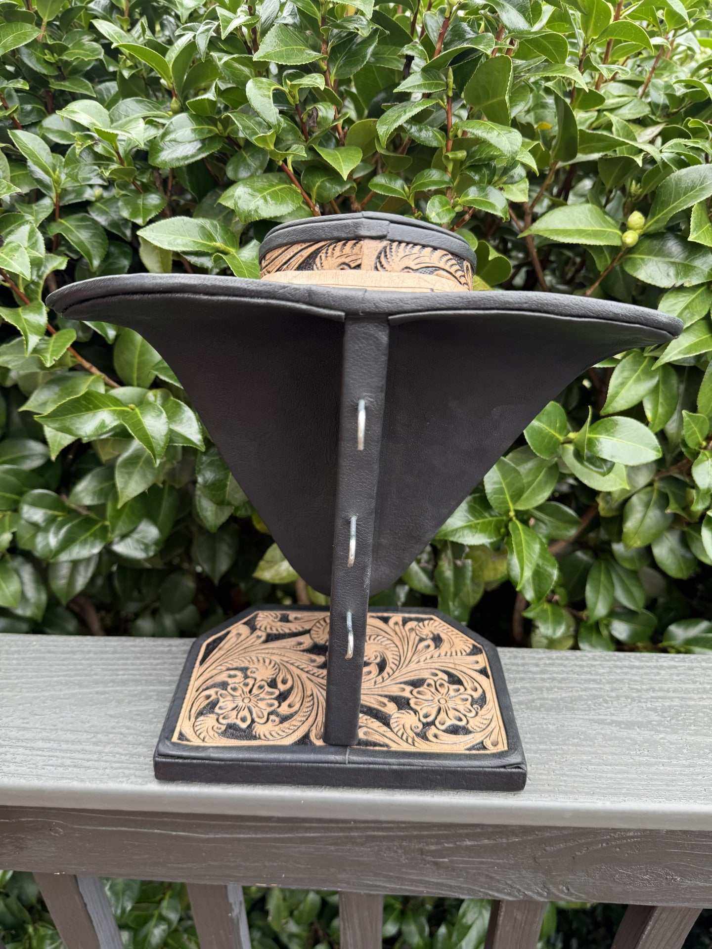 Beige and brown all tooled leather necklace display stand with intricate floral design