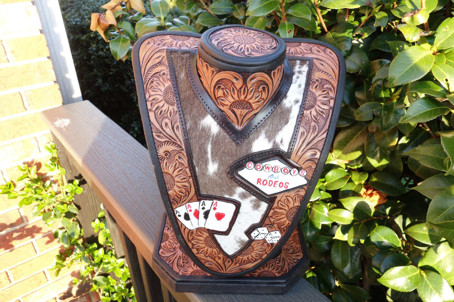Medium Brown tooled leather necklace display with brown and white cowhide for stylish jewelry organization