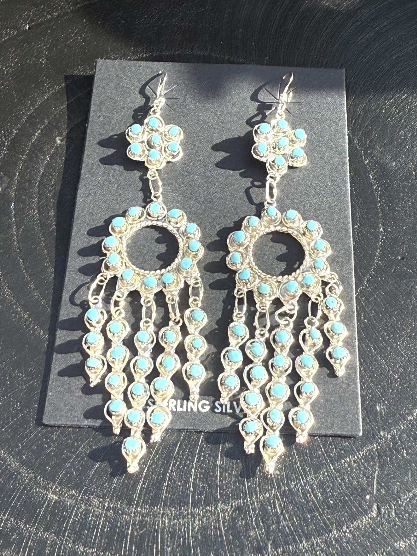 Snake Eye Earrings by Navajo artist Wayne Johnson with turquoise dangles and silver detailing