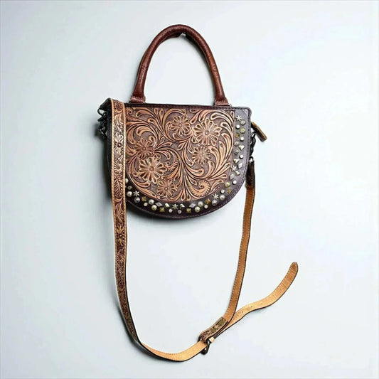 Evelyn tooled leather crossbody bag with floral design and adjustable strap