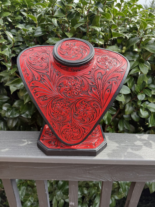 Red and brown all tooled leather necklace display with intricate floral patterns and elegant design