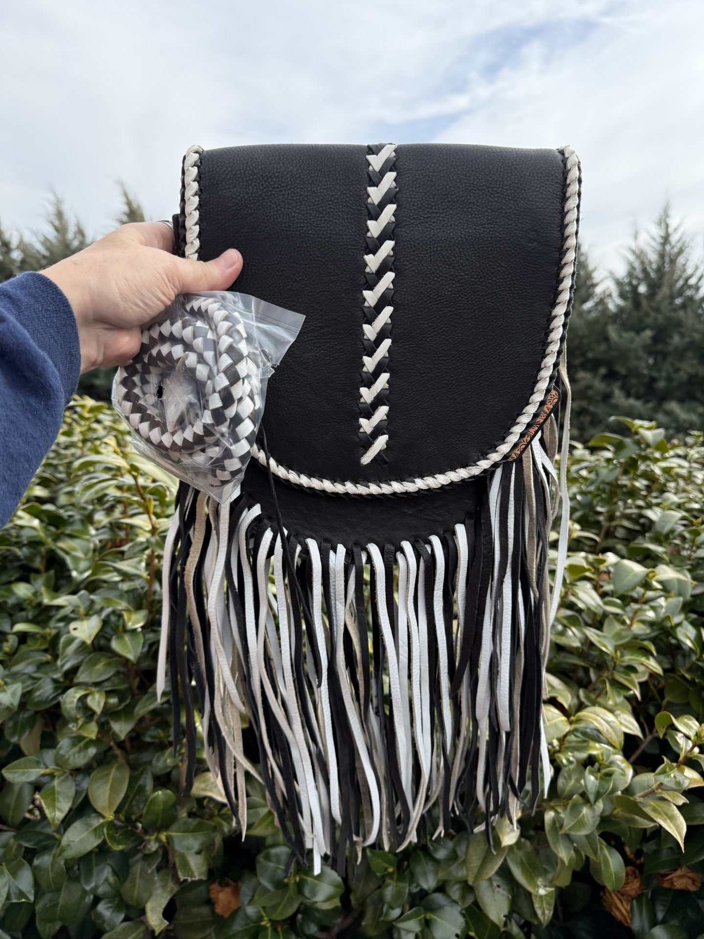 Leather black-white fringe crossbody bag with hand braided strap and genuine cowhide leather