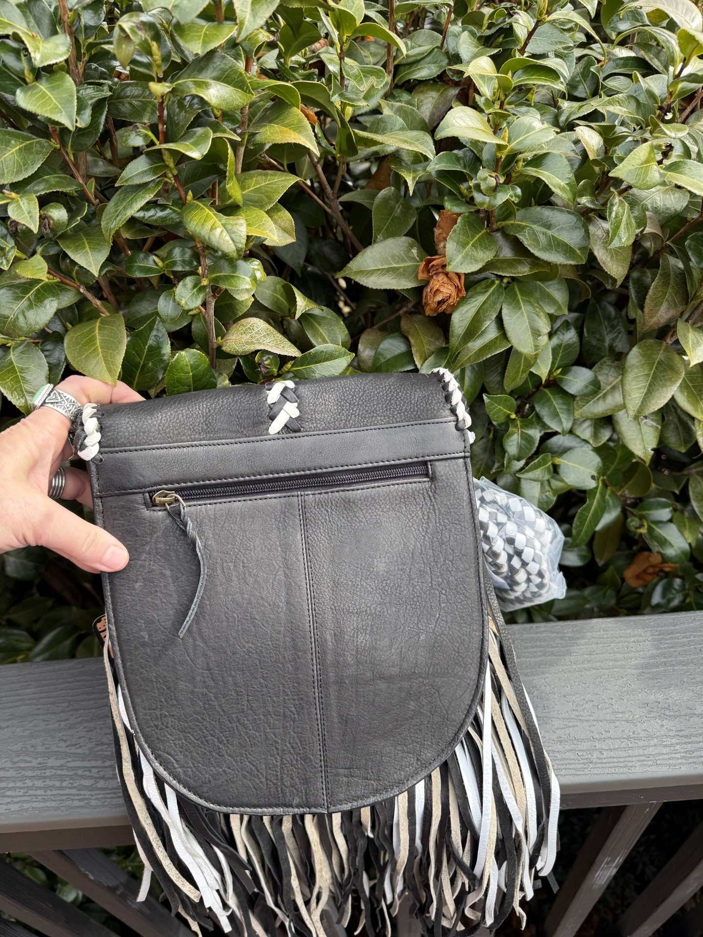 Leather black-white fringe crossbody bag with hand-braided strap and genuine cowhide leather