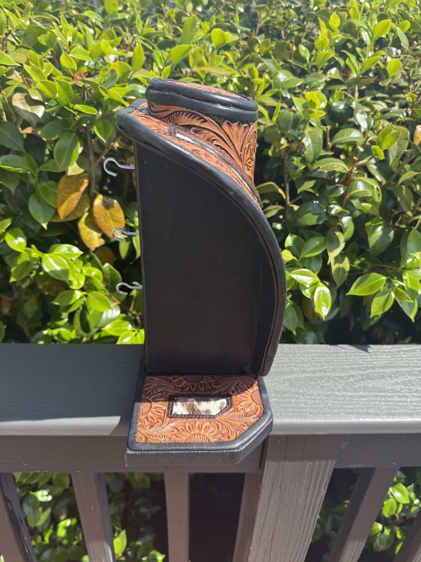 Medium Brown tooled leather necklace display with black and white cowhide stylish jewelry organizer
