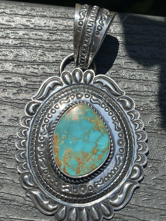 Native American Pilot Mountain Turquoise Pendant with intricate silver design and turquoise stone centerpiece