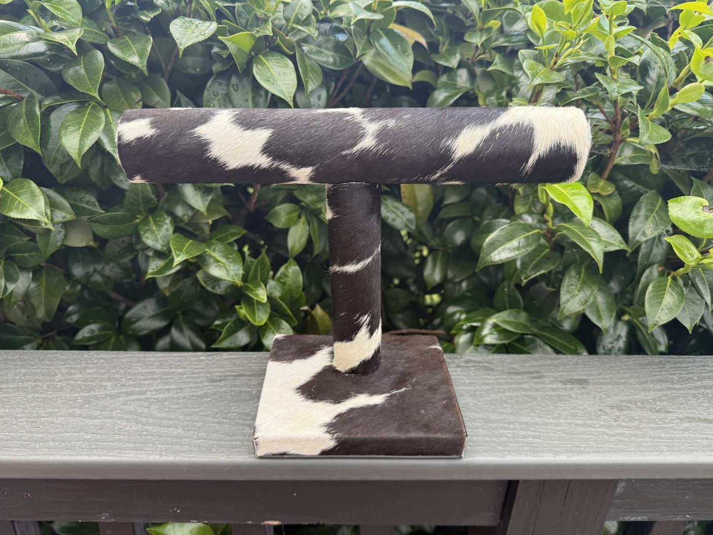 Dark brown cowhide bangle-cuff holder with rustic Western design