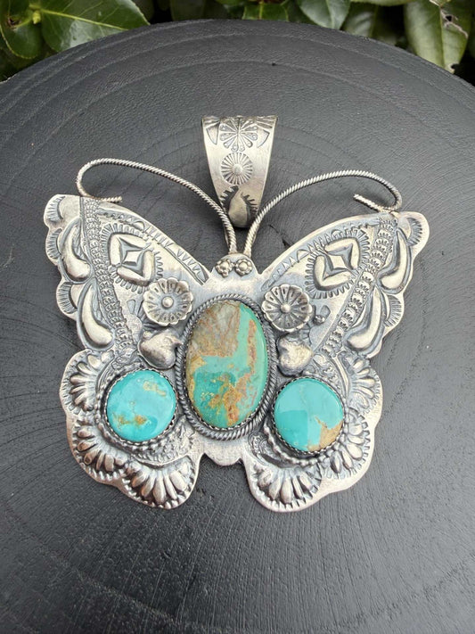 Kingman Butterfly Pendant by Richard Yazza with turquoise stones and floral stamp work