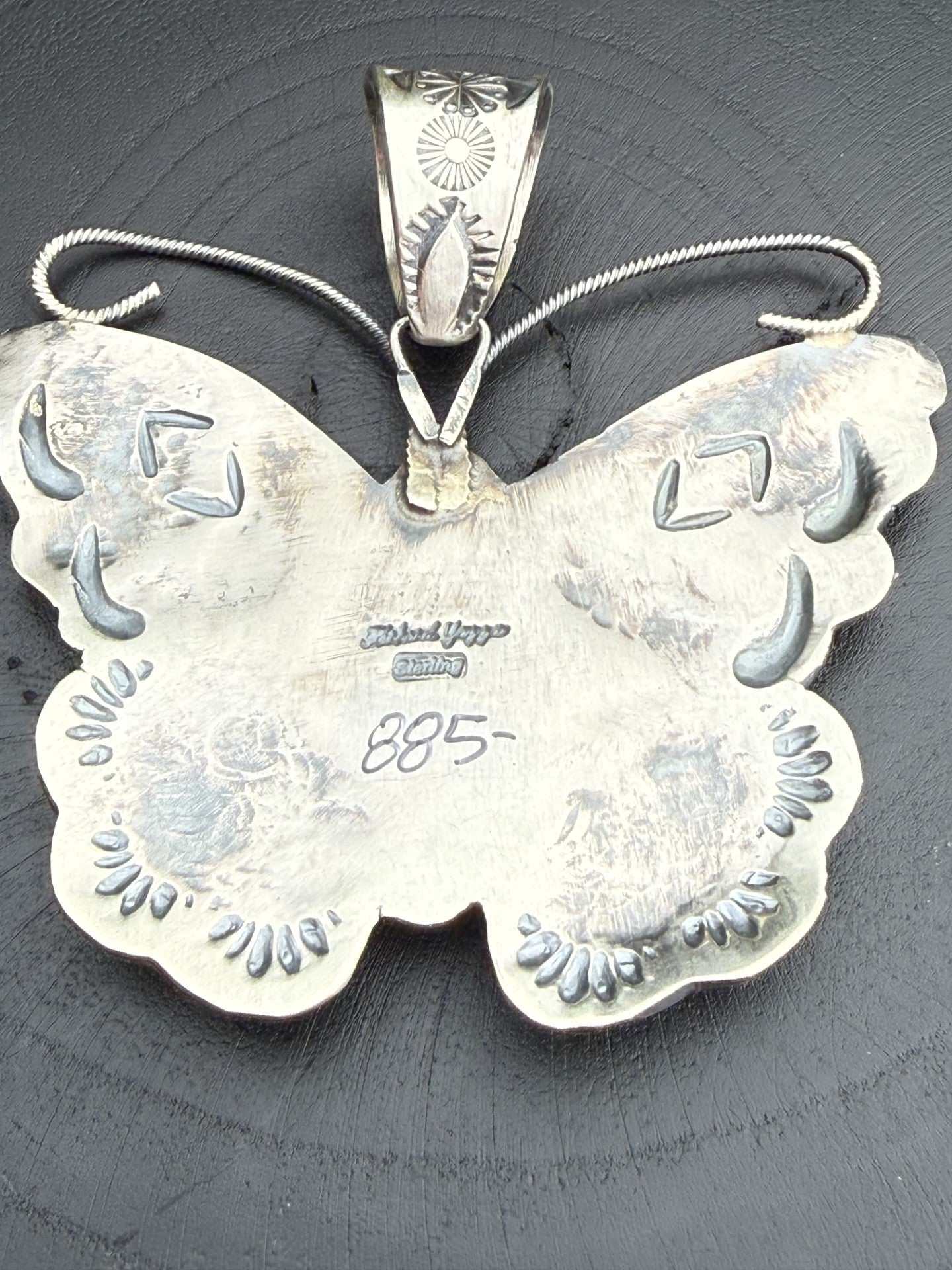 Kingman Butterfly Pendant by Richard Yazza with intricate stamp work and floral details