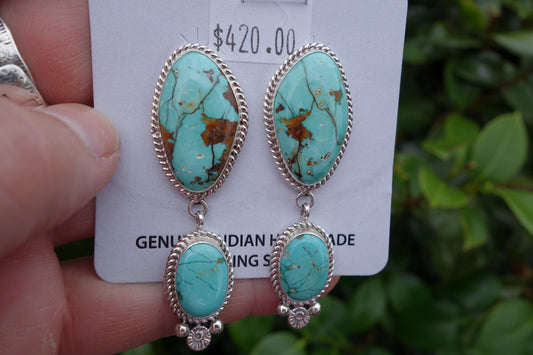 Handcrafted Royston Turquoise Earrings with brown matrix by Navajo artist, featuring silver detailing.