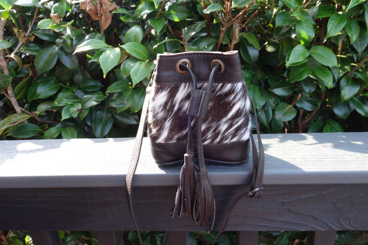 Brown cowhide drawstring crossbody kids-bags