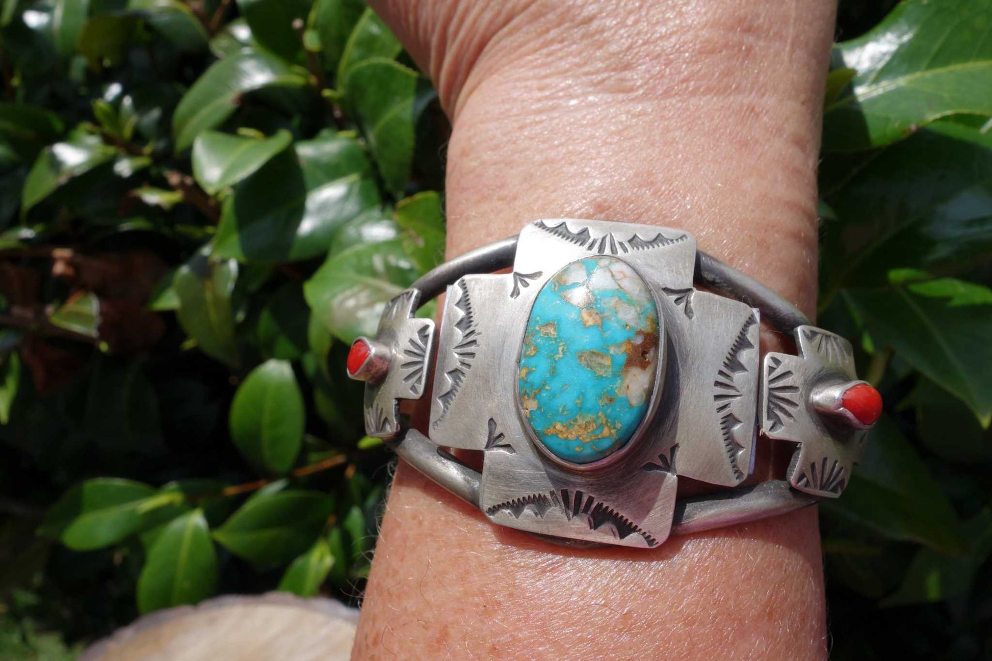 Royston and Coral Cuff with turquoise and coral stones on wrist.