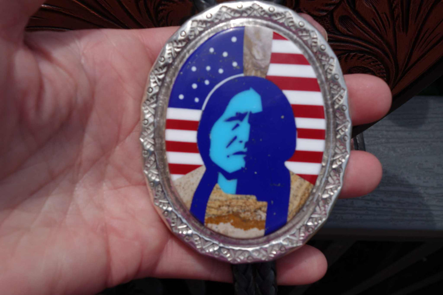 Calvin Desson silver Navajo bolo tie with Sitting Bull design and turquoise inlay