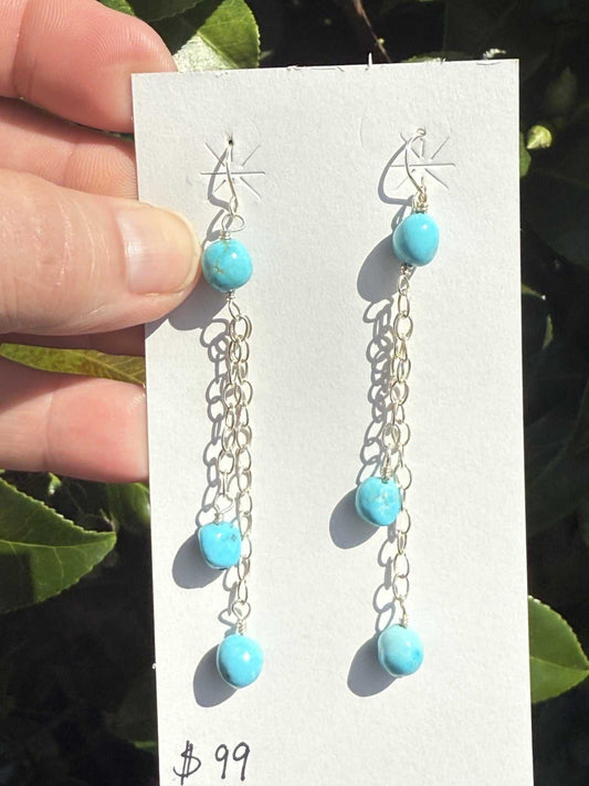 Sterling silver chain dangle earrings with Kingman turquoise balls by Navajo artist, 3 inches long.