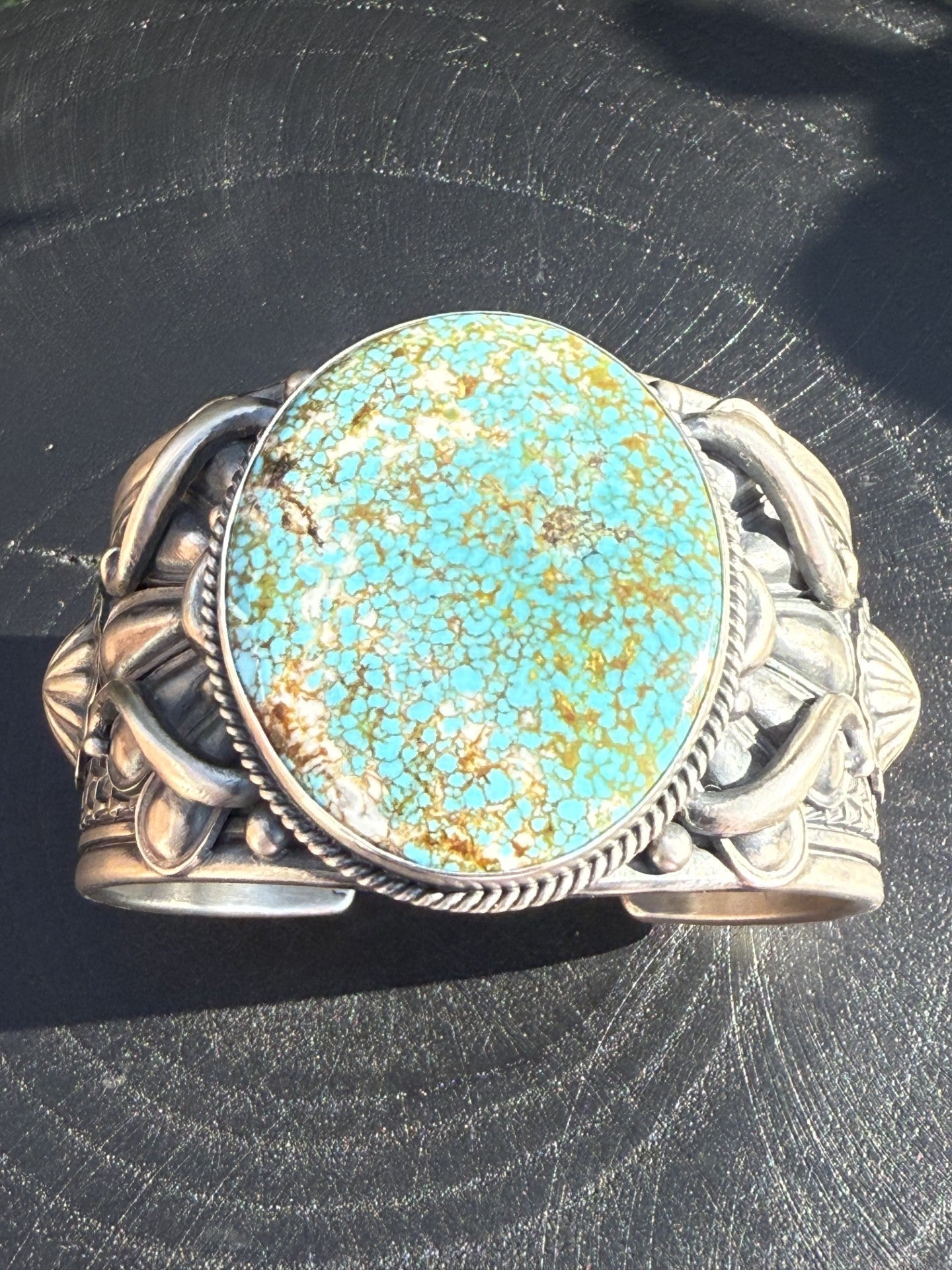 Turquoise Mountain Cuff by Derrick Gordon featuring large turquoise stone and ingot silver band