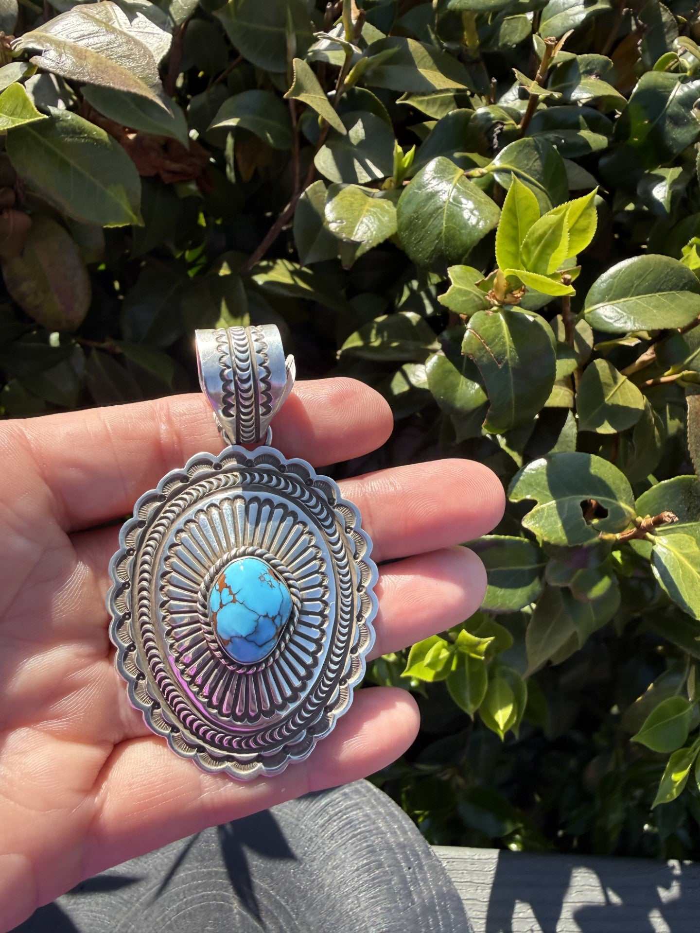 Native American Egyptian Turquoise Pendant with sterling silver and intricate stamp work by Arnold Blackgoat