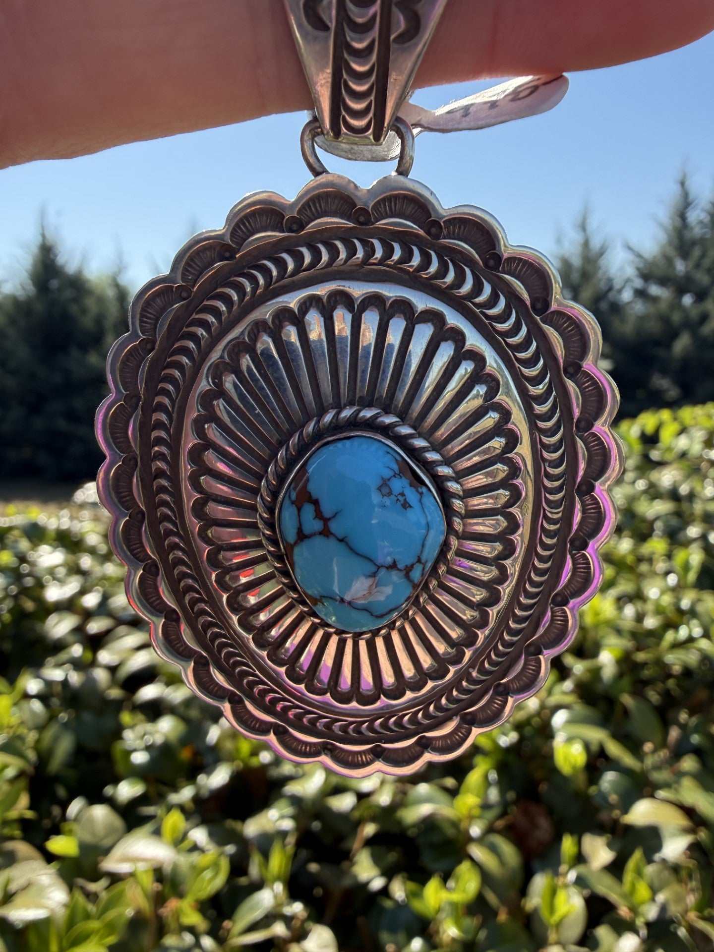 Native American Egyptian Turquoise Pendant handcrafted with sterling silver and blue turquoise stone by Arnold Blackgoat