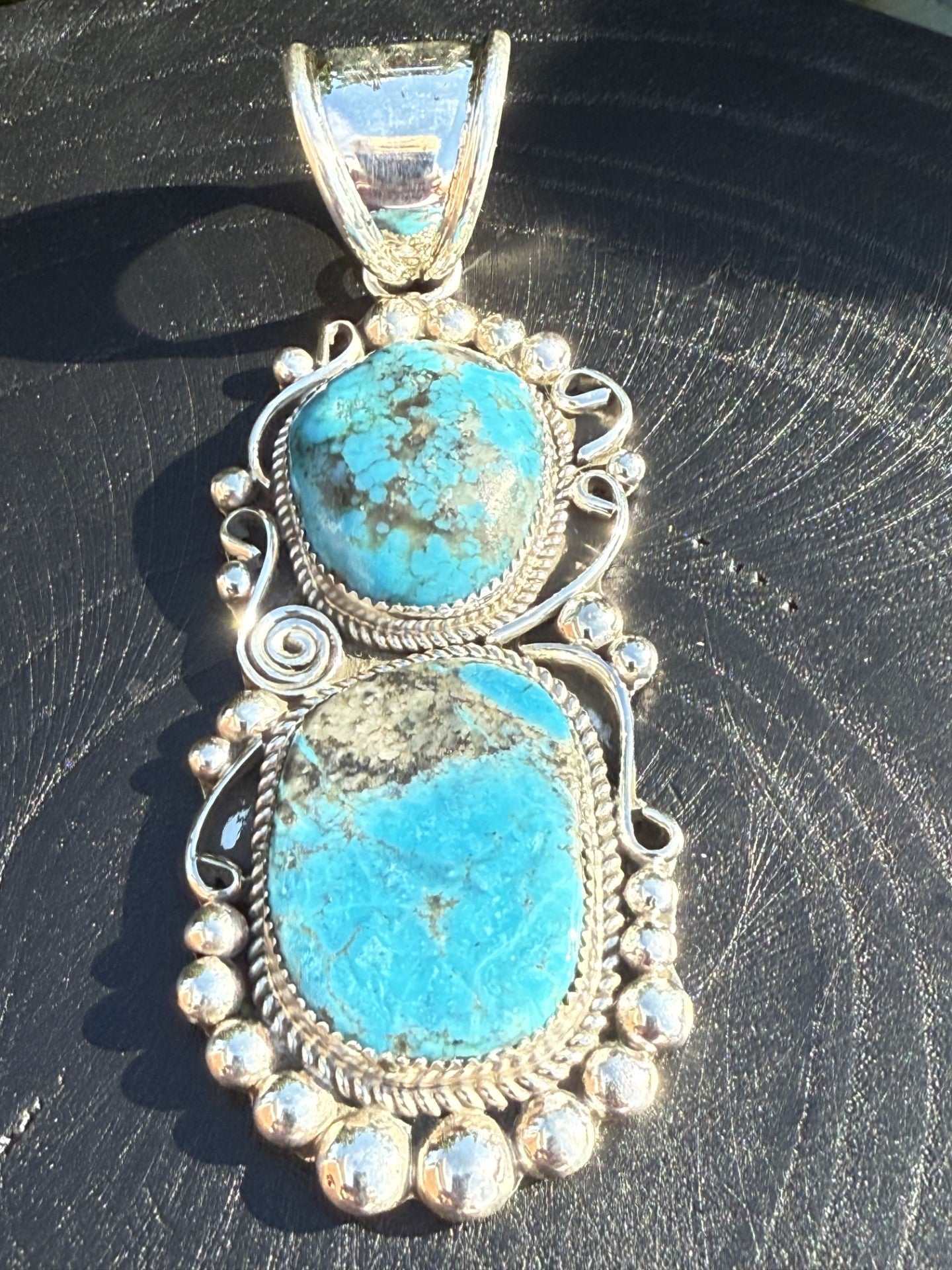 Kingman Turquoise Pendant with two turquoise stones and detailed sterling silver work by Ray Nez