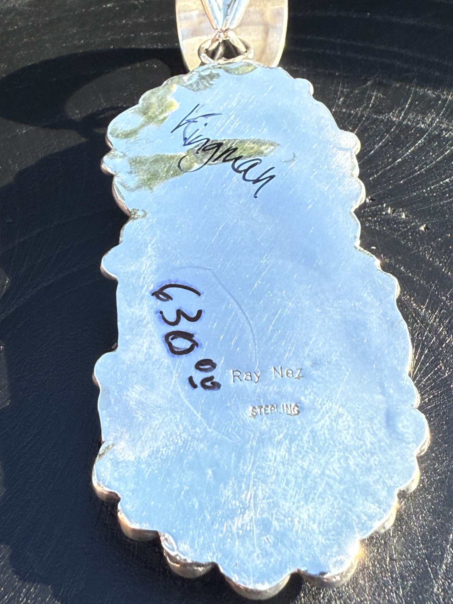 Back view of Kingman Turquoise Pendant by Ray Nez in sterling silver with handwritten markings