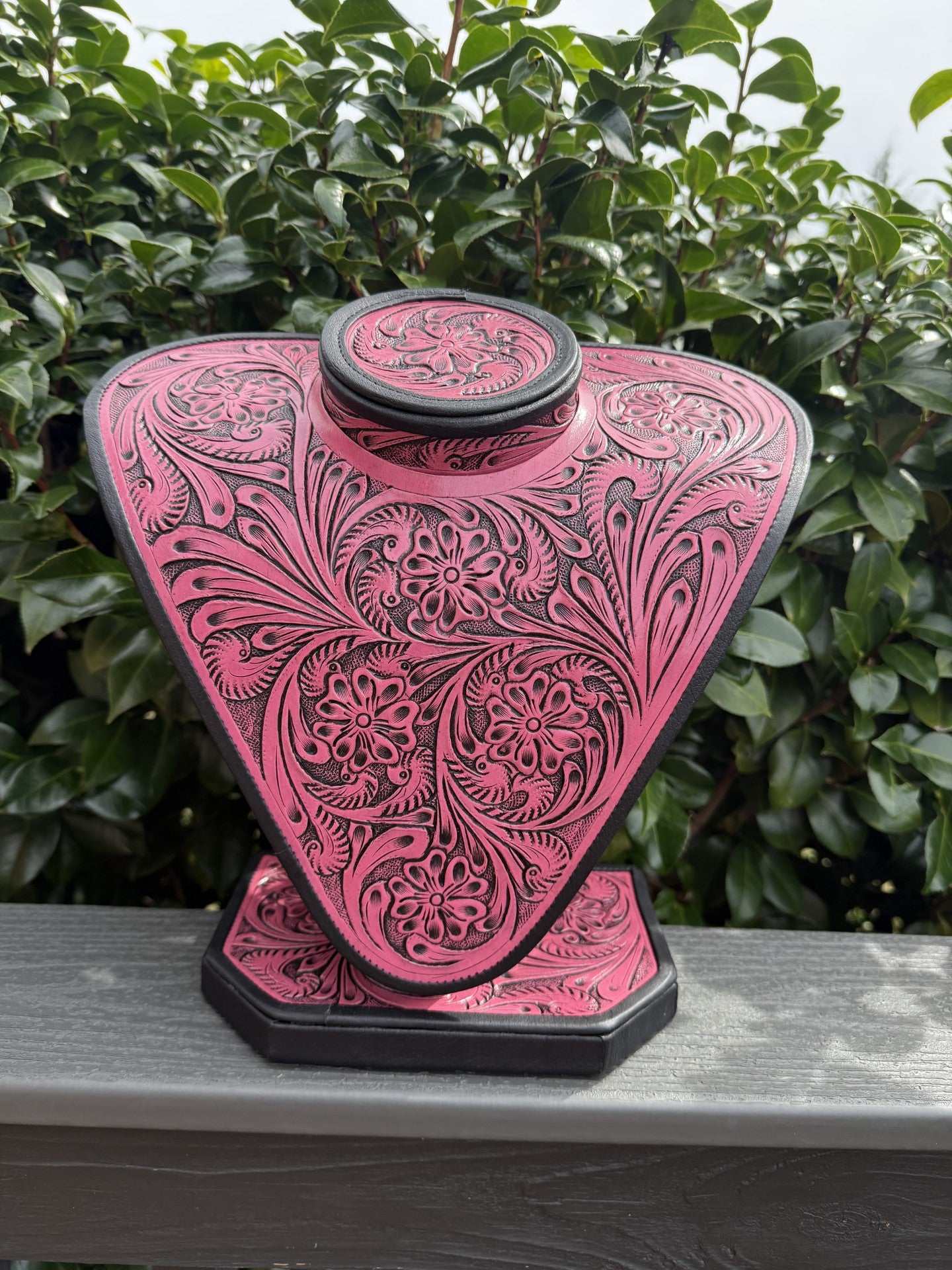 Pink and brownblack all tooled leather necklace display showcasing elegant craftsmanship and premium leather quality