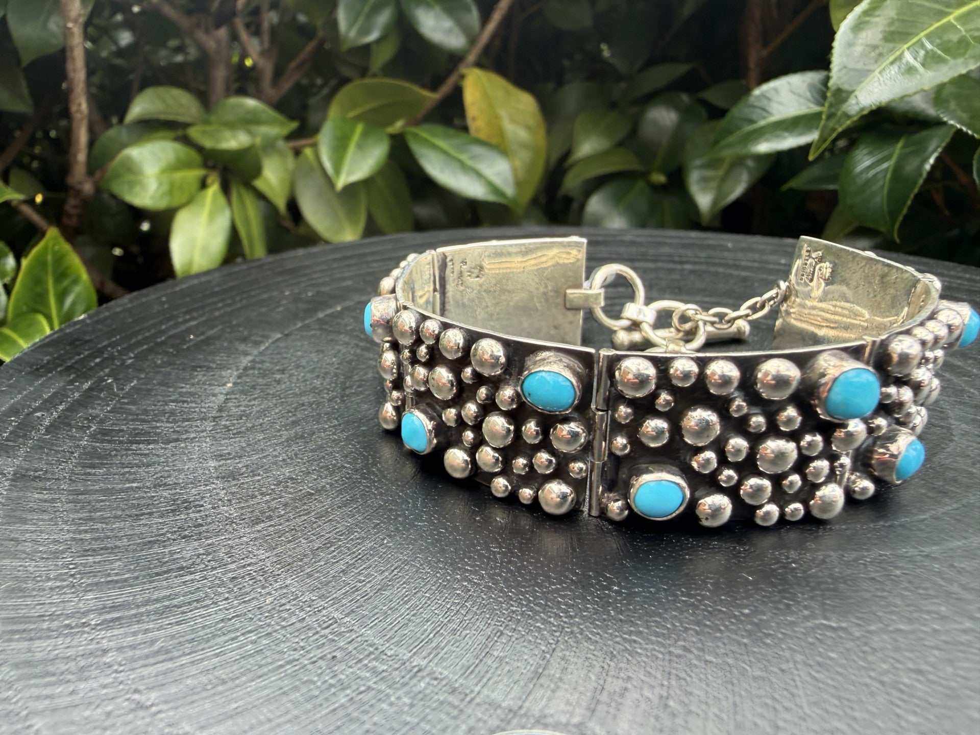 Large turquoise sterling silver TQ drop link bracelet by Raymond Coriz
