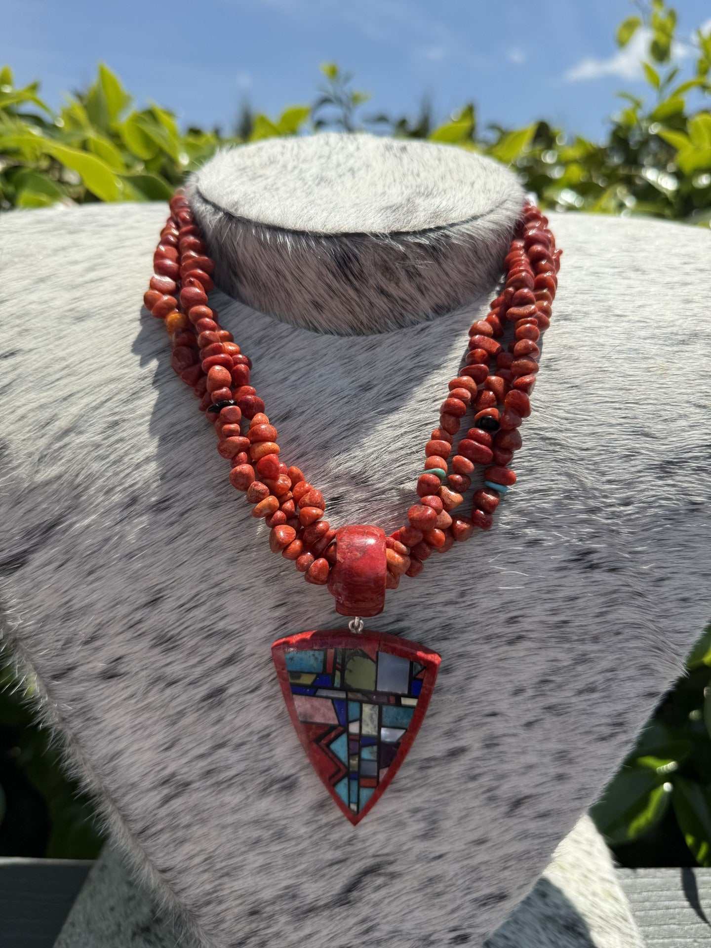 Chris Nieto Santo Domingo Pueblo Inlay pendant with multi-strand apple coral necklace handcrafted Native American jewelry