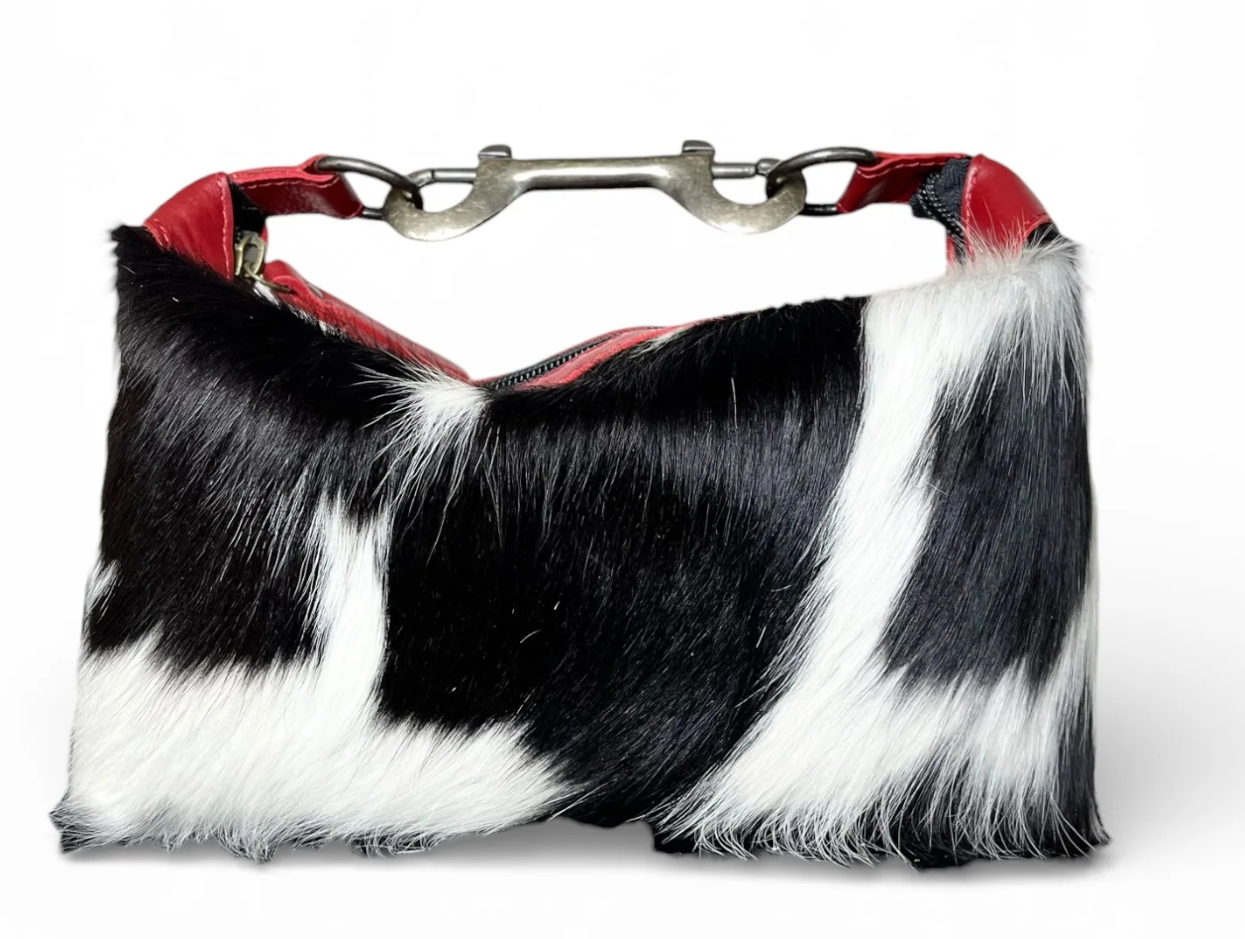Handcrafted red leather and cowhide purse with metal handle and natural cowhide pattern