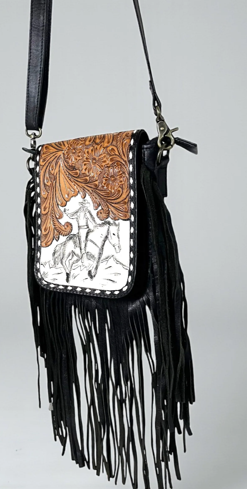 Black tooled leather fringe crossbody bag with adjustable strap and Western design