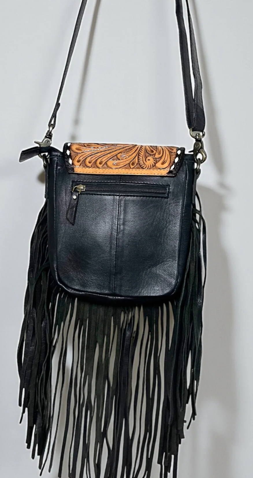 Black tooled leather fringe crossbody bag with adjustable strap and Western design