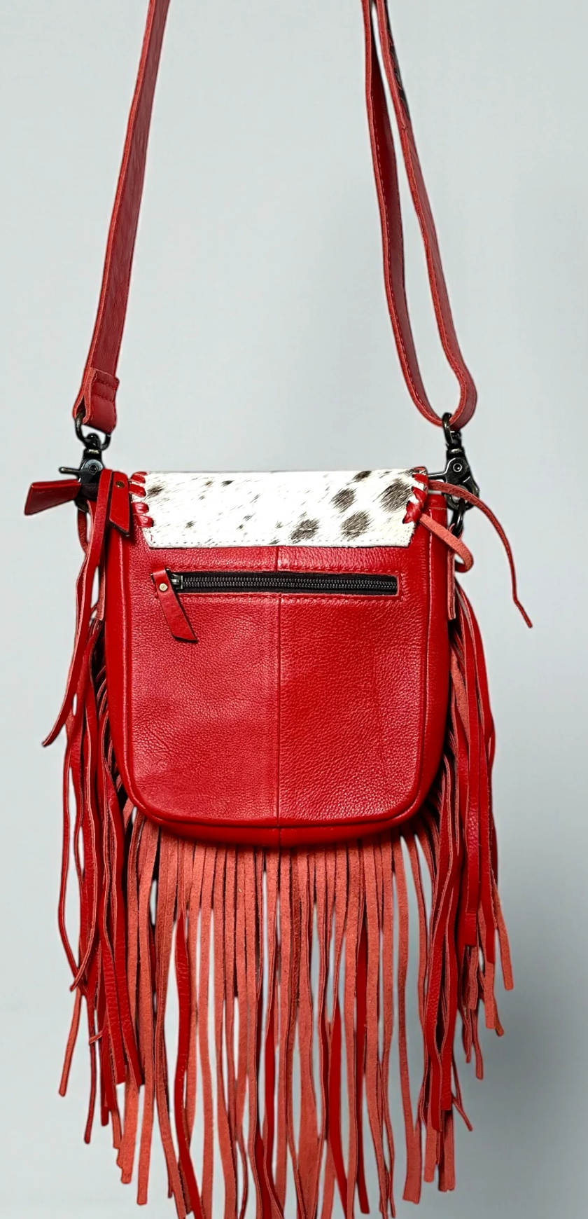Red bucking fringe crossbody bag with genuine tooled leather and adjustable strap