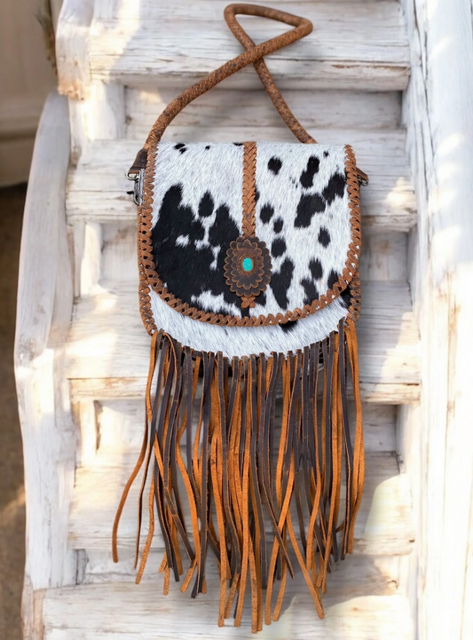 Stone Cowhide Fringe Crossbody bag with genuine leather and unique cowhide pattern.