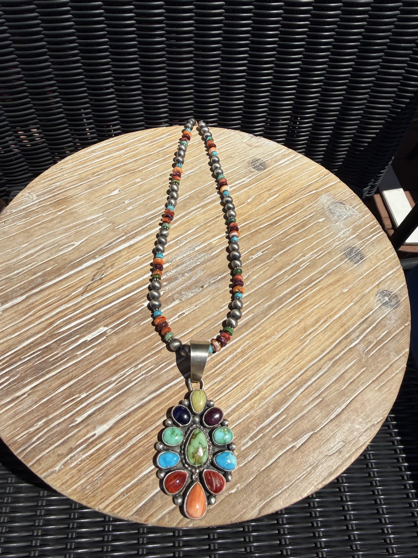 Multi stone necklace with Sonoran Gold and Kingman stones by Navajo silversmith Travis Jim