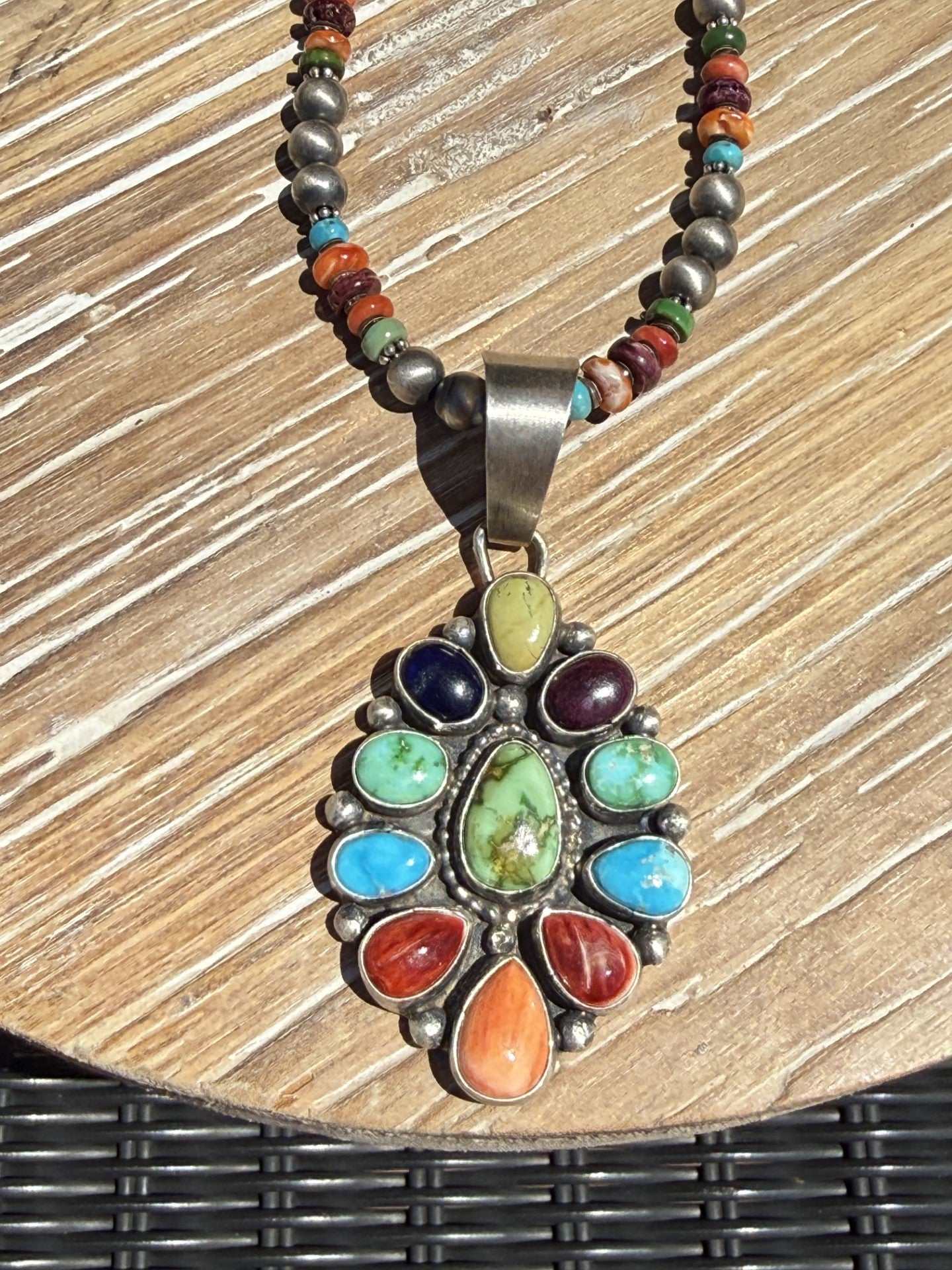 Colorful multi stone necklace by Navajo silversmith Travis Jim