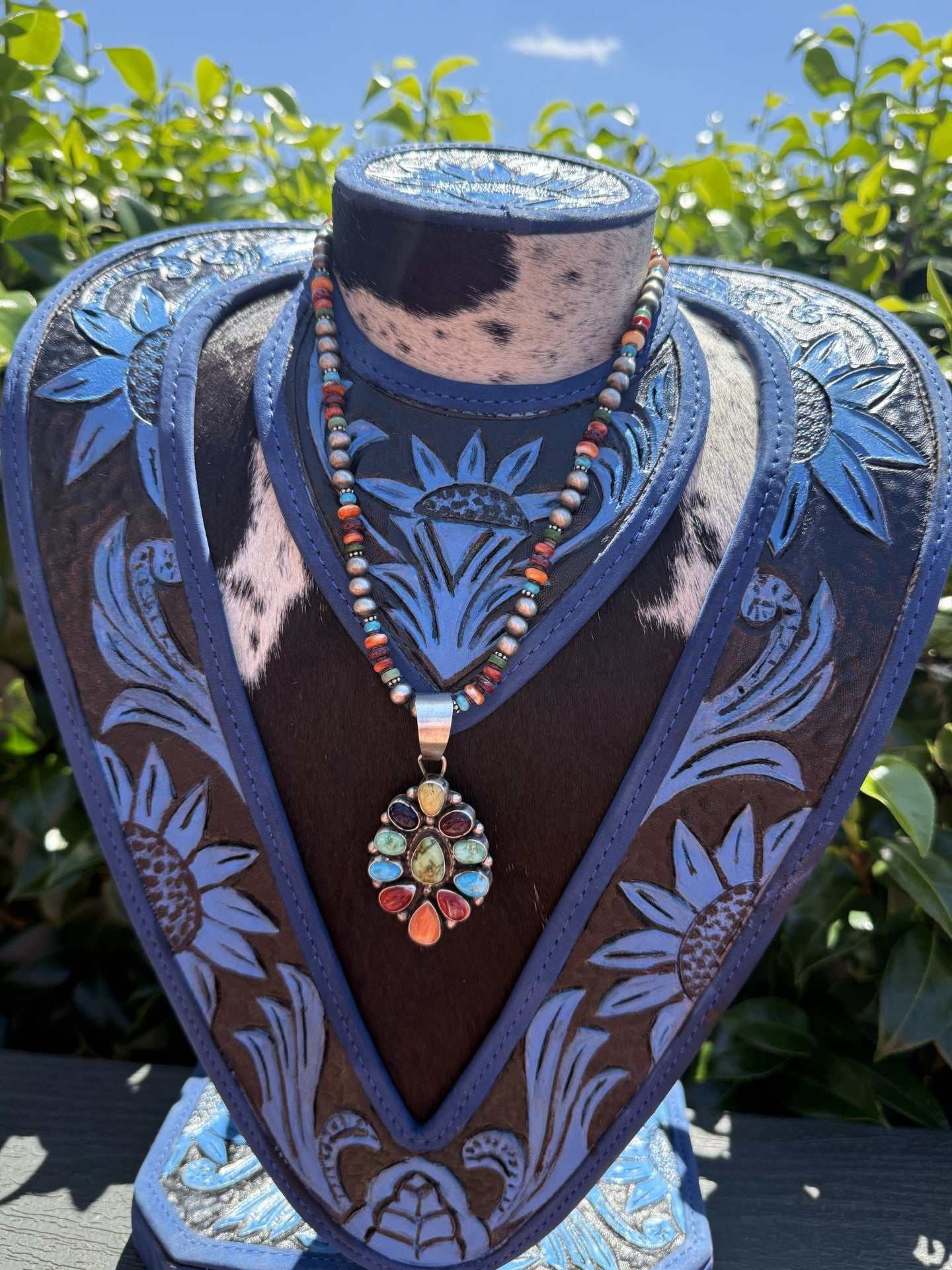 Multi stone necklace with Sonoran Gold and Kingman stones by Navajo silversmith Travis Jim