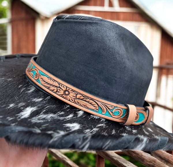Genuine leather hat band with intricate design on a black cowhide hat.