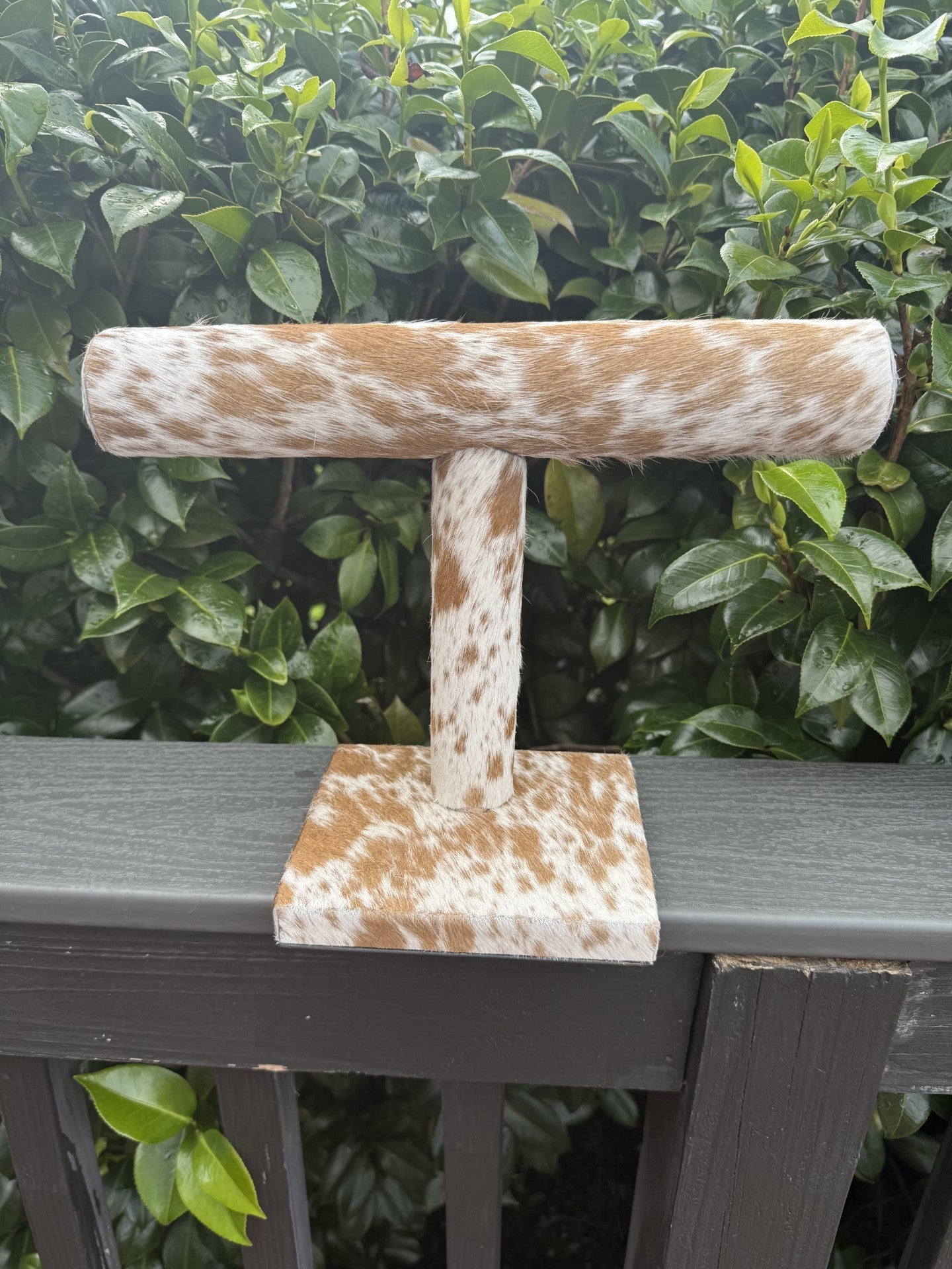 Beige and white cowhide bangle-cuff holder for bracelet display and organization