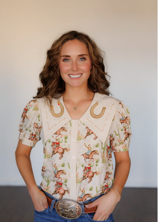 Cactus Cowgirl Knit button-up top with Western print on cream fabric, embroidered collar, and puffed short sleeves