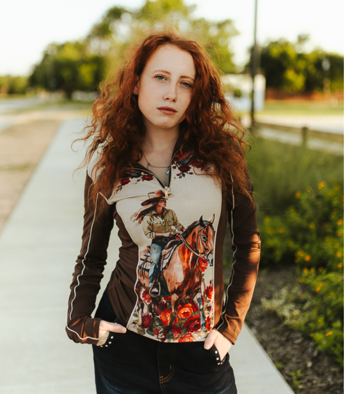 Cowgirl Horse Floral Printed quarter-zip top with brown long sleeves and a colorful cowgirl-on-horseback floral front