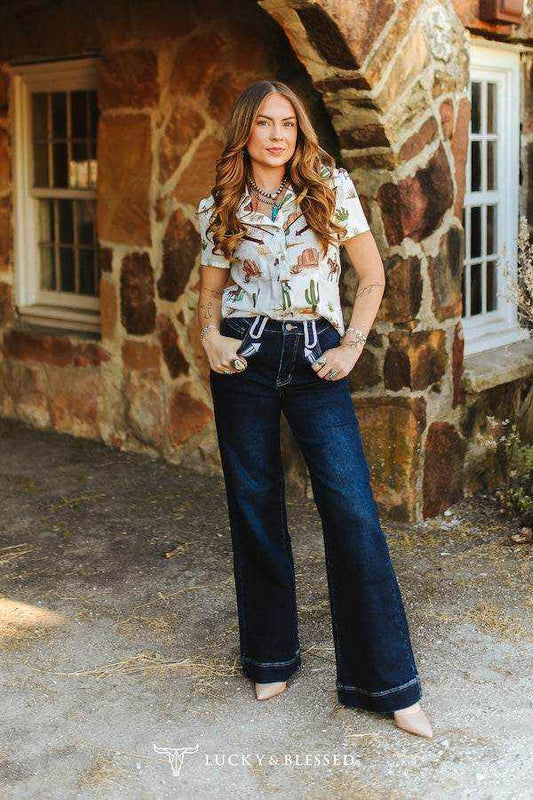 Dark Wash Stretch Denim high-rise wide leg jeans with two-tone white contrast stitching and Western arrow pocket detail
