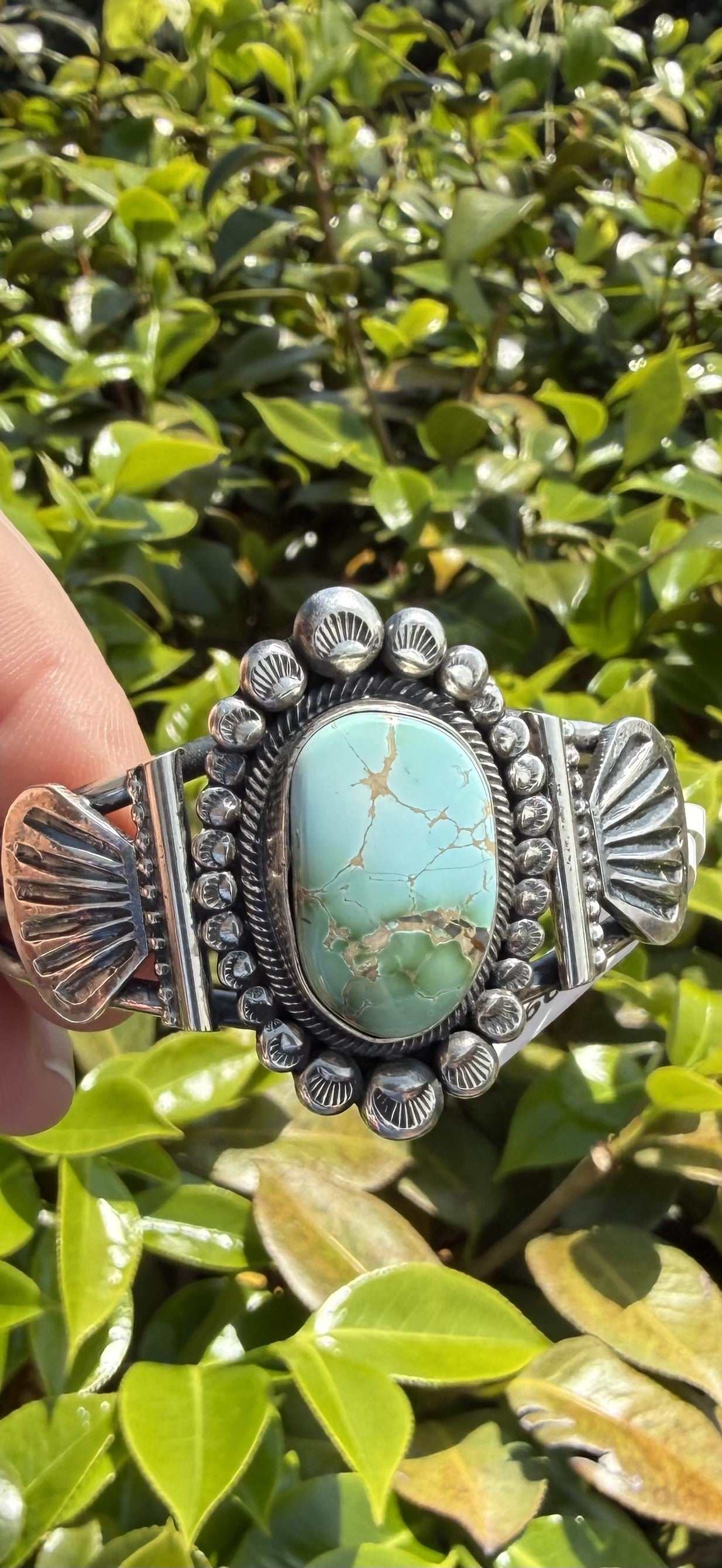 Royston Turquoise Sterling Silver Cuff bracelet by Navajo artist Leon Martinez with blue-green stone and sterling silver rails