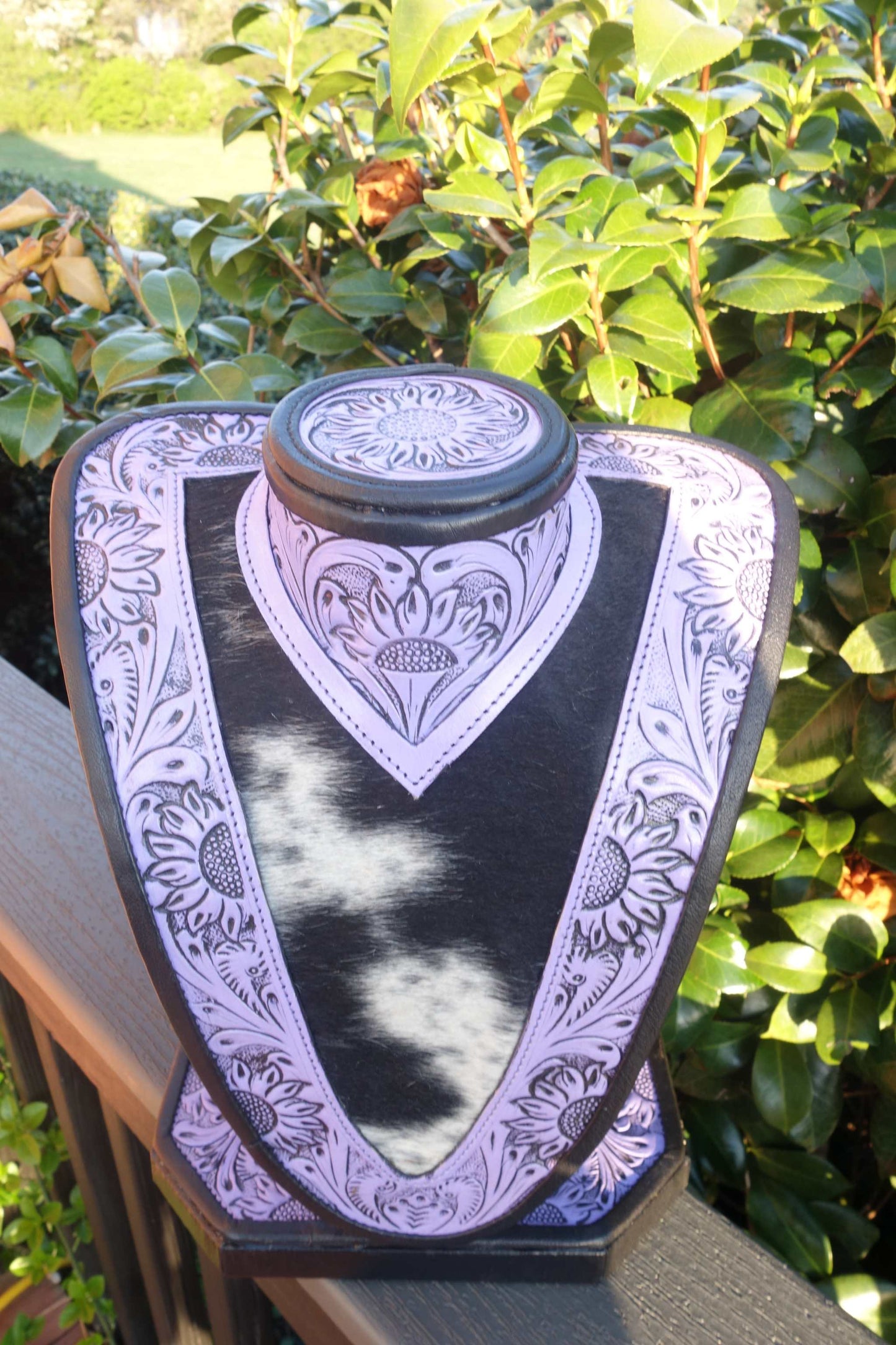 Medium Purple Tooled Leather Necklace Display with Black and White Cowhide background for showcasing necklaces