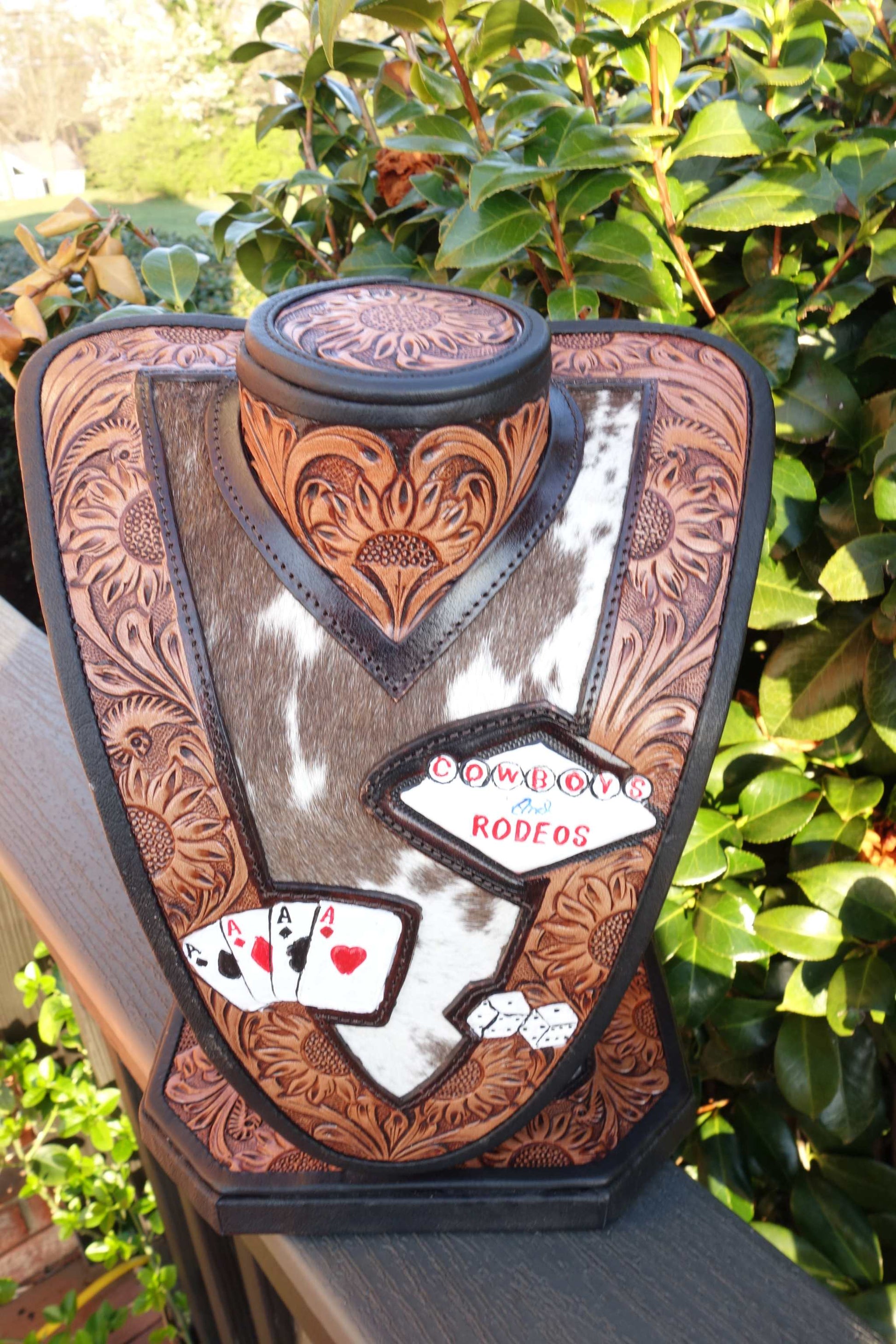 Medium Brown tooled Leather necklace display with brown and white cowhide for stylish jewelry organization