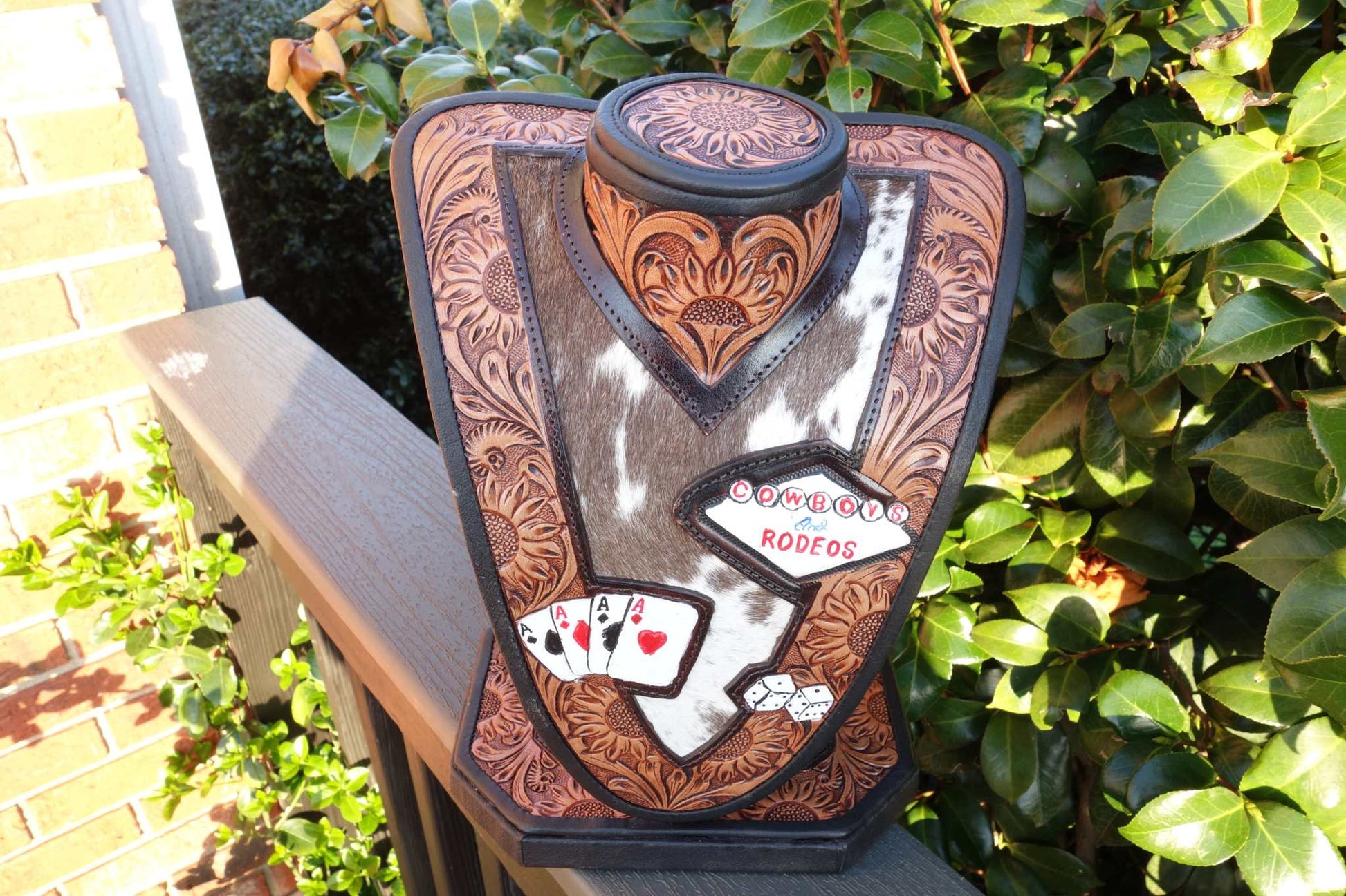 Medium Brown tooled leather necklace display with brown and white cowhide for stylish jewelry organization