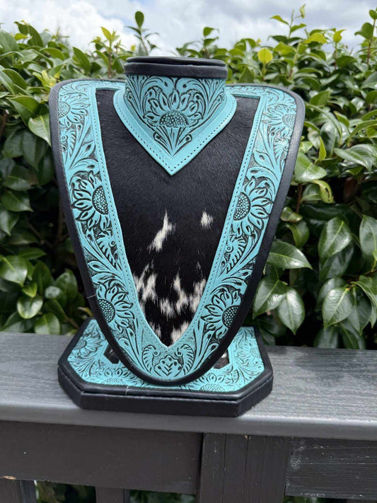 Medium turquoise tooled leather necklace display with black and white cowhide