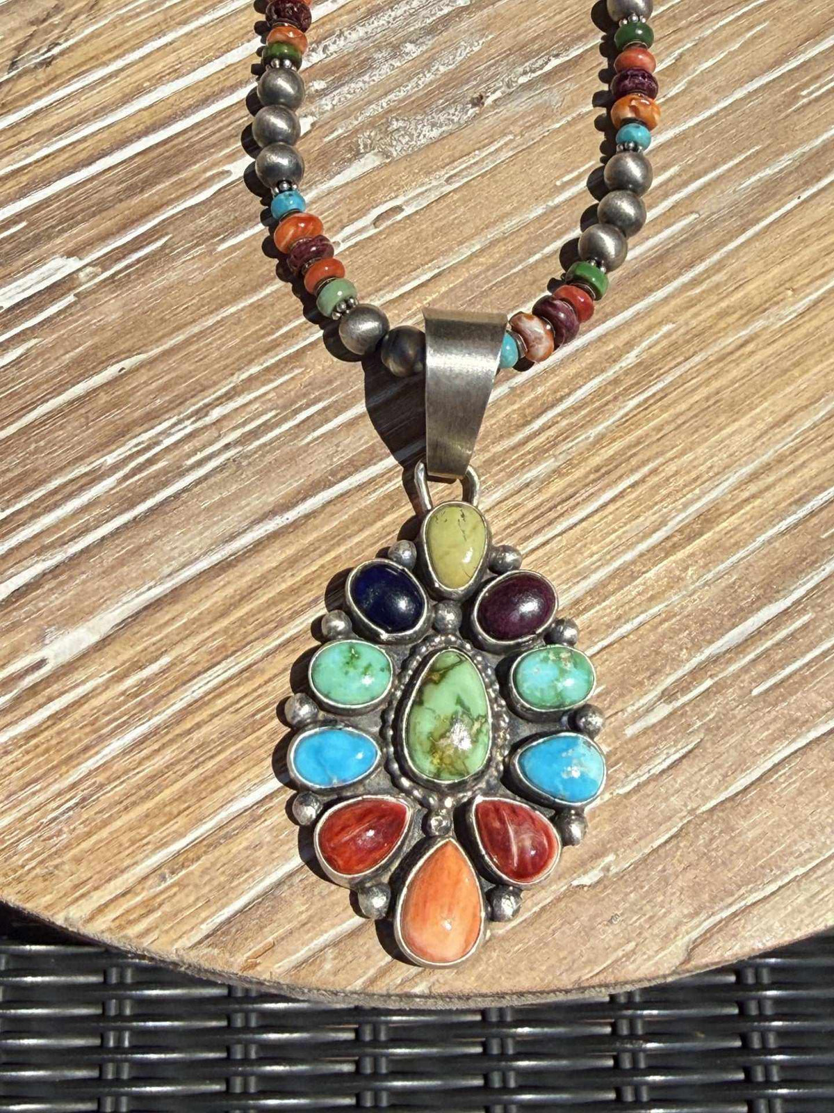 Colorful multi stone necklace by Navajo silversmith Travis Jim